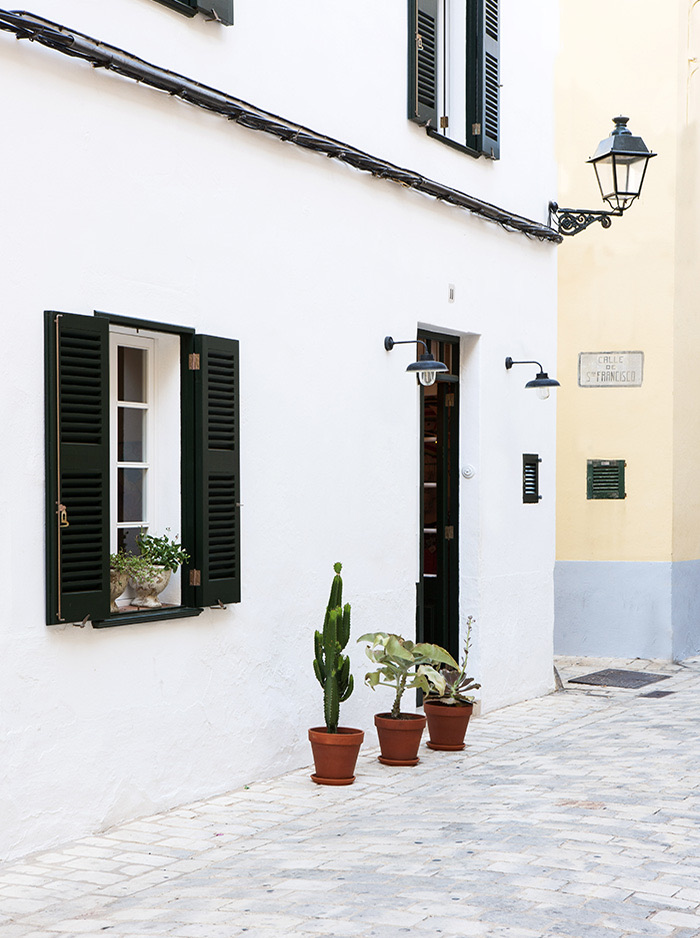 Ciutadella Menorca, Spain: Evelyne Mandel House - The Front Of The House With Green Shutters And Succulents In Etrracotta Containers