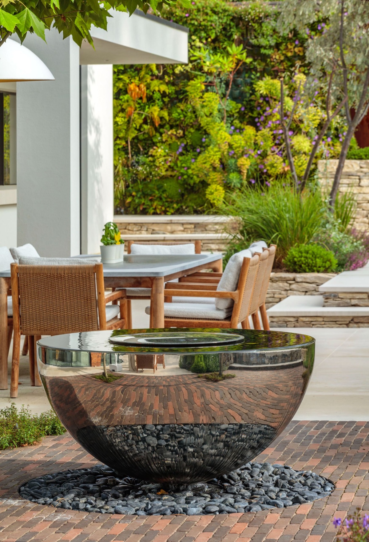 A David Harber bowl on a terrace beside a loggia